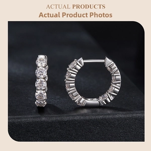 Macro view of S925 sterling silver hoop earrings with round-cut moissanite stones