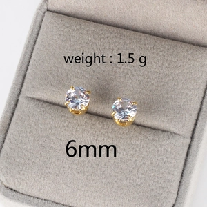 Macro detail of 6mm round cubic zirconia stud earrings with gold base in jewelry box
