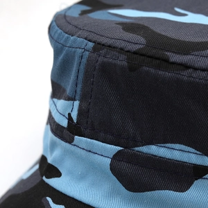Close-up of durable blue camouflage canvas fabric with reinforced double stitching detail