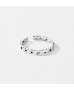 Close-up of S925 sterling silver ring with hollow star pattern and adjustable open band