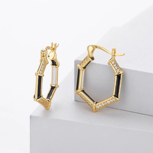S925 silver hexagonal hoop earrings with black enamel and zircons on grey platform