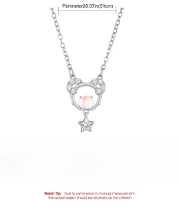 Detail of copper mouse pendant with sparkling crystals, moonstone and star charm