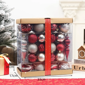 Detailed view of red and silver Christmas ball ornaments in a holiday gift box set