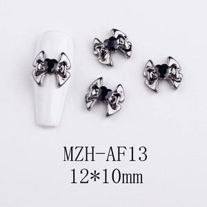 Gothic nail art charm featuring black heart gemstone on a metal bow, 12x10mm size