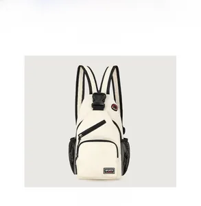Front view detail of white oxford chest bag with black zippers and sports patch
