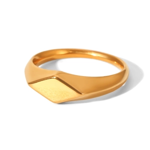 Macro view of gold stainless steel signet ring with geometric diamond flat surface