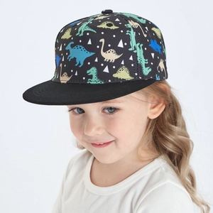 Detail of kids flat brim baseball cap featuring colorful cartoon dinosaur prints on black fabric