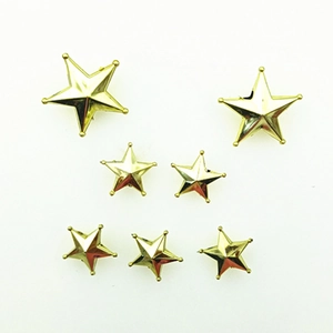 Collection of golden star Christmas tree toppers in various sizes on white background