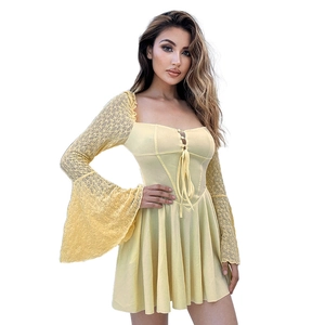 Detail of elegant lace trumpet sleeves and square neckline on a yellow vintage dress