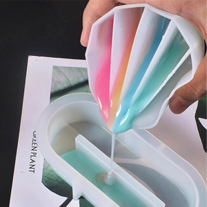 Close-up of 5-compartment silicone pouring cup for epoxy resin DIY color mixing process