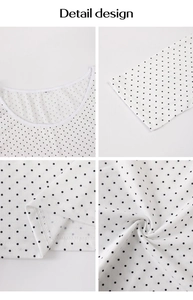 Détails du design montrant le col, les poignets et le tissu blanc à pois du haut à manches