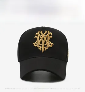 Close-up of intricate 3D golden embroidery on black cotton baseball cap front