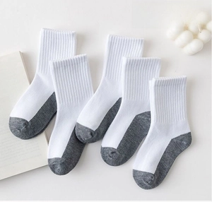 Flat lay of cotton crew socks with grey contrast heel and toe detail on white background