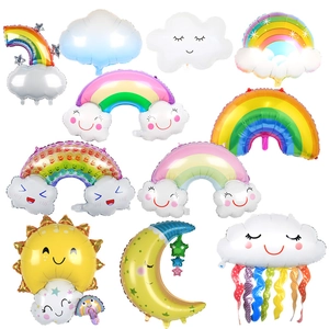 Weather themed balloons featuring smiley clouds and rainbow tassels for birthday party decor