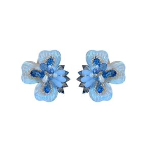 Blue crystal flower stud earrings with silver needles and sparkly rhinestone accents