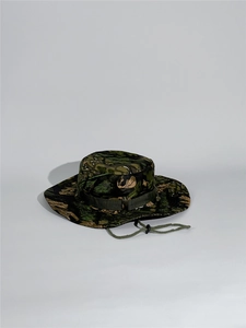 Detail of green jungle camo boonie hat featuring wide brim and adjustable chin strap