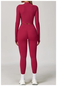Detail of high-waist yoga set with thumb holes and push-up effect in deep rose red