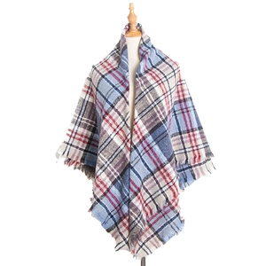 Plaid tassel triangle scarf with blue, red, and white checkered pattern on mannequin