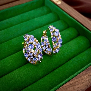 Luxe gold-plated geometric hoop earrings with sparkling diamonds and light purple crystals