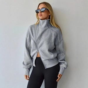 Detail of grey asymmetric double zipper design on high neck casual cotton sweatshirt