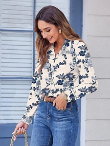 Women's floral print long sleeve collared shirt in cream and blue with button-up front