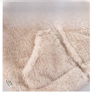 Detail view of soft fleece fabric with functional front pocket and zipper for kids' coat