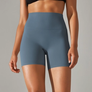 Close-up of high-waisted fitness shorts in misty blue with elastic tummy control fabric
