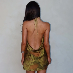 Detailed back view of backless halter dress showing vibrant green floral satin print