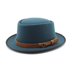 Deep teal wool boater hat with brown leather band and gold buckle on white background