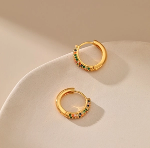 Macro shot of 18K gold plated hoop earrings with micro-paved rainbow colored zircons