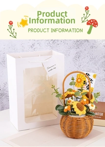 Hand-knitted sunflower bouquet in brown basket with a white window gift bag and card