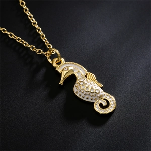 Elegant 18K gold plated seahorse pendant necklace with white enamel and sparkling crystal