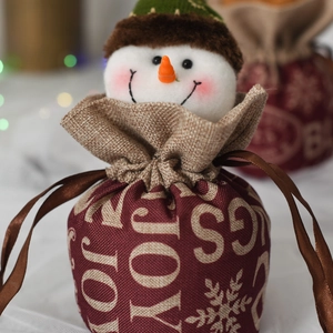 Burgundy linen Christmas drawstring bag with plush snowman decor and Joy snowflake print