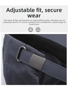 Detailed macro view of adjustable metal buckle and breathable mesh on dark grey cap