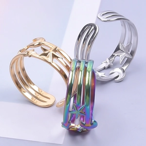 Detailed view of adjustable star and moon open rings in gold, silver, and rainbow finishes