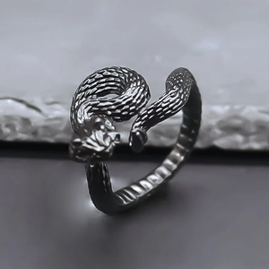 Macro shot of retro serpent ring with detailed scales and adjustable wrap-around design