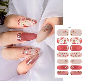 Detail of pink floral nail wraps YS-002 with gold foil and dried flower accents