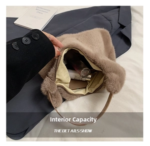Detail of spacious plush brown faux fur handbag showing interior capacity for cosmetics