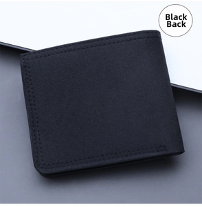 Detailed view of the black canvas bifold wallet reverse side with reinforced stitching