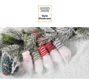 Detailed set of five knitted Christmas gnome ornaments with hats and wooden noses