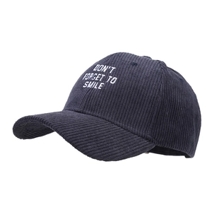 Corduroy baseball cap in navy blue with Don't Forget To Smile embroidery
