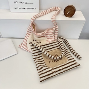 Detailed view of striped plush tote bag featuring soft lamb wool texture and FUN PIACE embroidery
