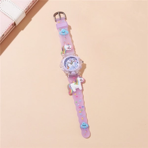 Close-up of kids cartoon unicorn watch with purple silicone strap and 3D decorative patch