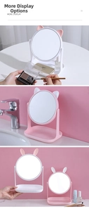 Rotating desktop makeup mirror with cute animal ears and storage base tray detail
