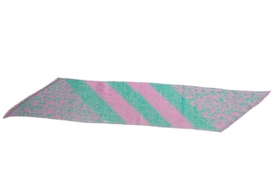 Detailed close-up of pink and green leopard print scarf texture with fringe edges
