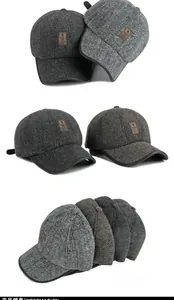 Detail of herringbone wool blend baseball hats with ear protection and leather logo patches