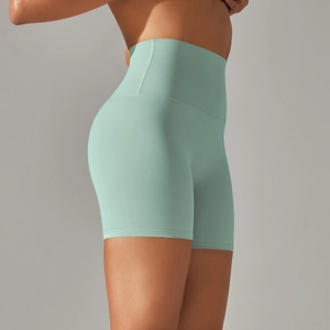 Detailed side view of high-waist mint green yoga shorts showing squat-proof fabric