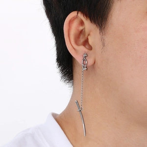 Gothic silver skull earring with long sword pendant and chain detail on model