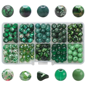 Detailed view of 10 compartments box with green cracked glass and crystal beads for DIY