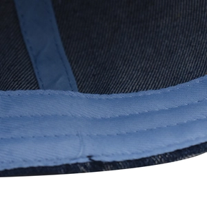 Detailed macro view of denim baseball cap interior featuring cotton sweatband and reinforced stitching
